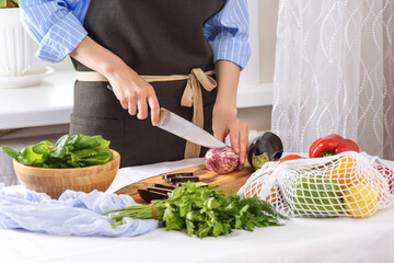 woman hands slicing eggplant, process of cooking Ratatouille, dinner, salad