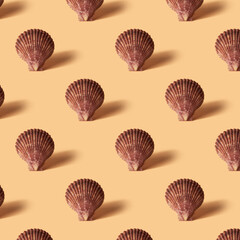 Seamless colorful pattern of shells on yellow color background.