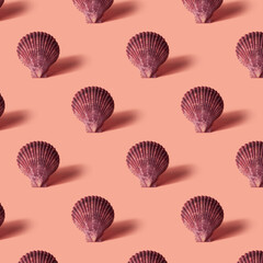 Seamless colorful pattern of shells on coral color background.