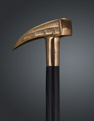 Walking stick and crutches with a handle in the form of hammer.