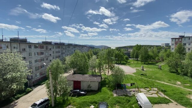 Very beautiful view of the windows from the courtyard and mountains and sky. The inscription on the transformer substation TP-86 and RU-10 / 0.4 kV. 4K shooting