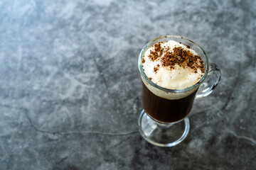 Homemade Alcoholic Amaretto Coffee with Cognac and Whipped Cream.