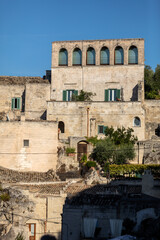 Fototapeta premium View of the Sassi di Matera a historic district in the city of Matera, well-known for their ancient cave dwellings. Basilicata. Italy
