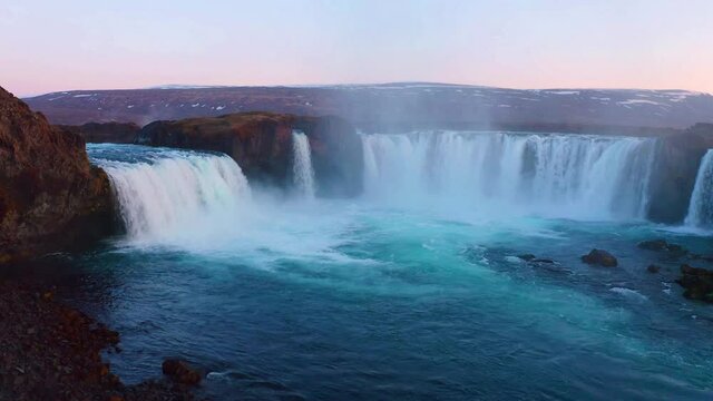 4k drone flight moving to the side footage (Ultra High Definition). Breathtaking sunset on Skjalfandafljot river, Iceland, Europe. Astonishing summer view of Godafoss waterfall.