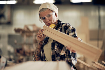 Hipster woman working with wood