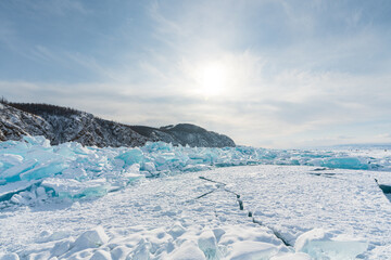 Beautiful crack that goes beyond the horizon on the ice of lake Baikal.