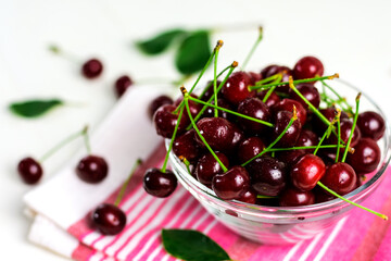 Fresh sour cherries in glass bowl