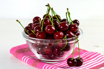 Fresh sour cherries in glass bowl