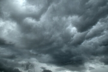 Fototapeta na wymiar Dramatic dark gray cloudy sky in bad weather condition before storm