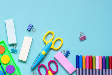 Bright stationery set on blue background with copy space for your design. Back to school background.