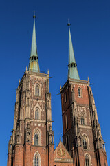 Fototapeta na wymiar View of Cathedral of St. John the Baptist (1272 - 1341) in Wrocław. Cathedral located in the Tumski Island (
