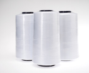 spools of thread on white background