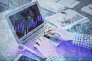 Double exposure of forex graph with man working on computer on background. Concept of market analysis.