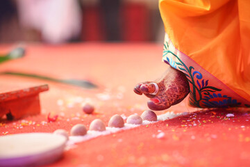 Indian traditional wedding bride take 7 steps  and touching to the betel nut 