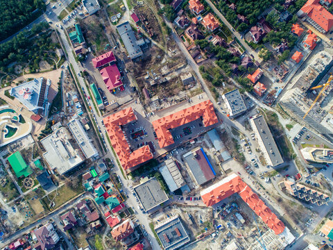 Residential complex of three multi-storey buildings with red roofs. The view from the top. © Александр Трихонюк