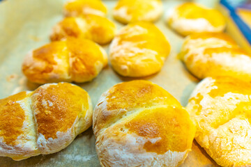 Handmade delicious fresh rolls with crusty tops. Fresh rolls from the oven.