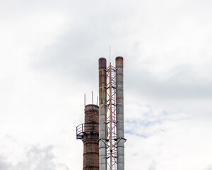 Water and metal tower against the sky