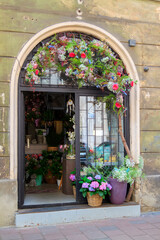 Fototapeta na wymiar Amazing shop window of the flower shop in an old building