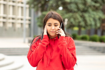 The woman was surprised after what she heard and stopped on the street