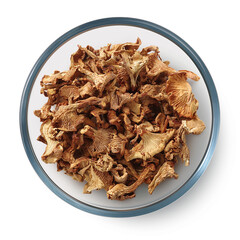 Dried mushrooms chanterelles
in a glass dish on a white background. Isolated dried mushrooms. Top view.