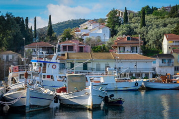 Fototapeta na wymiar The fishing village of Ligia on Lefkada island ,Greece with boats in the harbour.