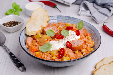 Stewed rice with beans, sausages and vegetables