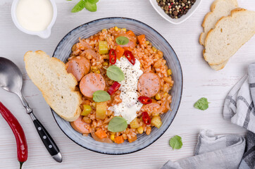 Stewed rice with beans, sausages and vegetables
