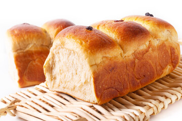 Food Baking concept Fresh baked organic homemade soft milk loaf bread on Wicker bread tray