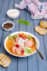 Soup with rice and beans, sausages and vegetables