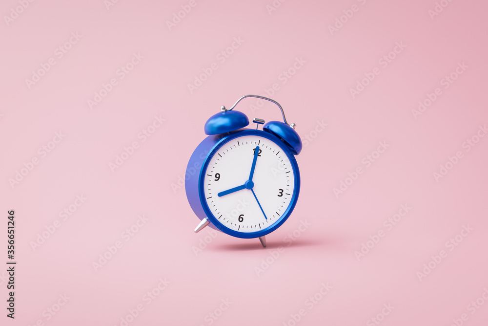 Aufkleber blue alarm clock ringing on pink background with rush hour concept. notification to wake up time or 