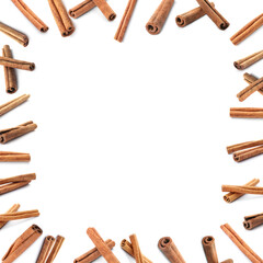 Set with aromatic cinnamon sticks on white background