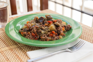 dish of vegetable stew. stewed eggplant, minced meat, carrots, peppers, onion squid