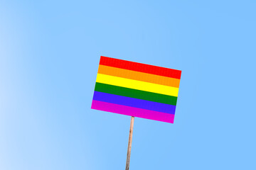 Lgbt pride concept. Holding a banner with the lesbian, gay, bisexual and transgender LGBT rainbow...