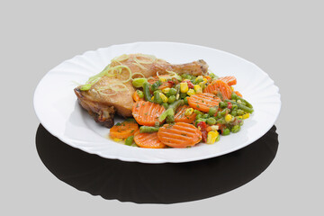 Romanian traditional dishes - chicken legs with vegetables saute