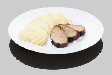 Romanian traditional dish - pork tenderloin grilled with mashed potatoes