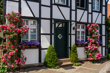 Fototapeta na wymiar HERTEN, GERMANY Timber framed house with floral decoration and colored ornaments in historic city center