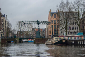 A bridge over the narrow canals of Amsterdam in Holland