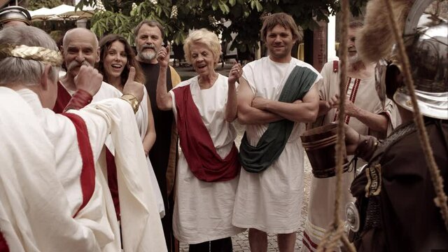 Emperor Gives Thumbs Up To Crowd Of Romans Who Begin To Cheer