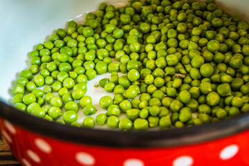 fresh green peas in a bowl