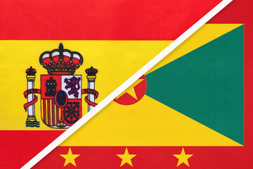 Obraz premium Spain and Grenada, symbol of two national flags from textile. Partnership between European and American countries.