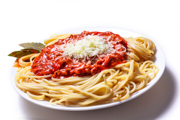 Delicious Spaguetti Pasta with bolognesa tomato sauce and chopped meat. Adorned with cheese and Laurel leaf