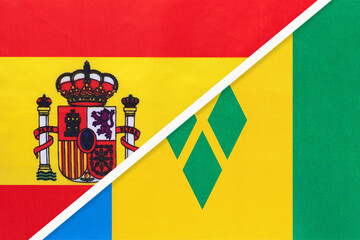 Spain and Saint Vincent and the Grenadines, symbol of two national flags from textile. Partnership between countries.