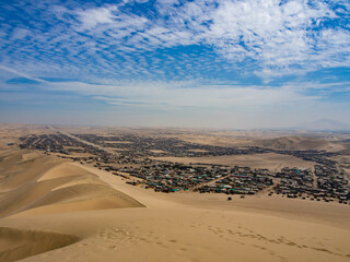 Fototapeta na wymiar Desert sand dunes of Ica, Peru near Huacachina at a hot, sunny day 