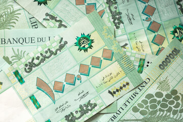 Group of 100 000 Lebanese pounds bills randomly scattered - currency of Lebanon