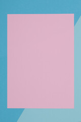 Blue and pink background, colored paper geometrically divides into zones, frame, copy, space.
