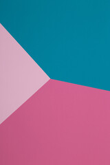 Blue and pink background, colored paper geometrically divides into zones, frame, copy, space.