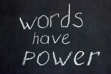 
Words on a dark board with white chalk: "words have power." The slogan of freelancers and copywriters and not only