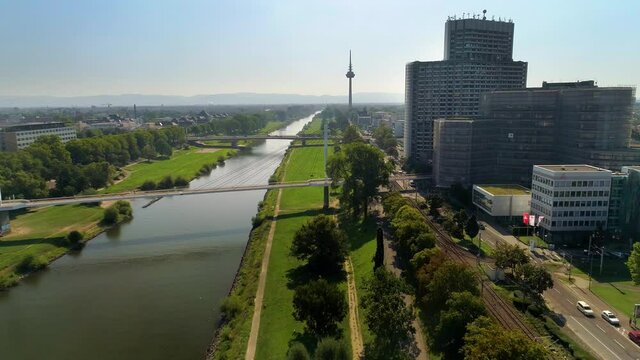 Beautiful Drone Flight above Green Area by the Rhein River in Mannheim City / Rhein Neckar 