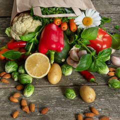 Eco friendly reusable shopping papper bag filled with fruit and vegetables