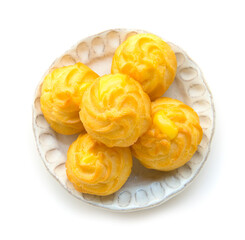 Eclair Dessert, filling Vanilla flavour is homemade style on white plate  top view isolated on a white background